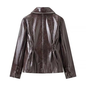 Detail of a shiny dark brown faux leather jacket back view with pleated waist and adjustable cuffs
