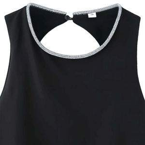 Black puff sleeve top with sparkling rhinestone neckline and hollow back detail