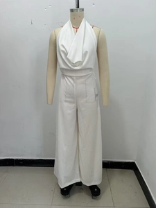 Detailed view of white cowl neck halter jumpsuit with high waist wide leg cut