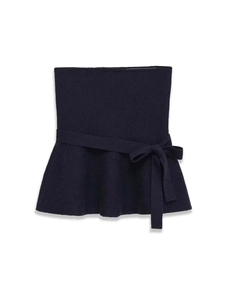 Detailed view of navy blue knitted peplum tube top with tied bow belt and ruffled hem