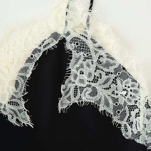Women's elegant black camisole featuring delicate white eyelash lace patchwork detail