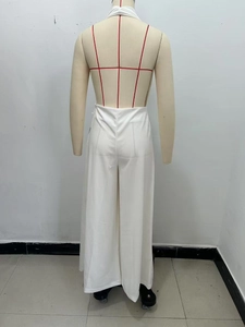 Rear view of white backless halter jumpsuit with high waist and wide leg design