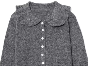 Close-up of a grey knit cardigan featuring a Peter Pan collar and white buttons