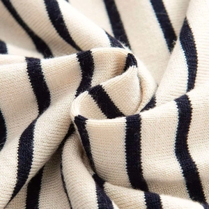Close-up of premium striped knit fabric showing soft texture and detailed stitching