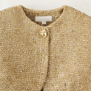 Elegant gold metallic tweed jacket for women featuring a collarless design and gold button