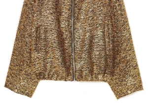 Detail of metallic gold fringed bomber jacket with zip closure and textured yarn fabric