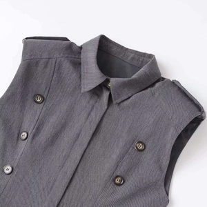 Chic grey double-breasted sleeveless blazer dress with sharp lapel and waist tailoring