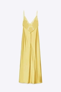 Detailed close-up of yellow satin midi dress featuring delicate lace trim and silk texture