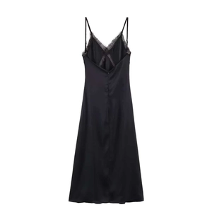 Detail showing the intricate eyelash lace trim and silk texture of black satin midi dress