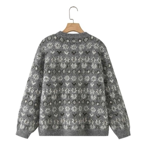Detailed back view of grey knit sweater with vintage snowflake jacquard patterns