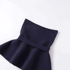 Navy knit tube top featuring a waist drawstring and stylish ruffled hem design