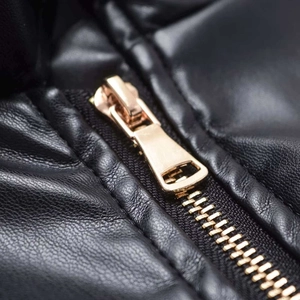 Women's black faux leather jacket featuring a high-quality light gold metal zipper detail