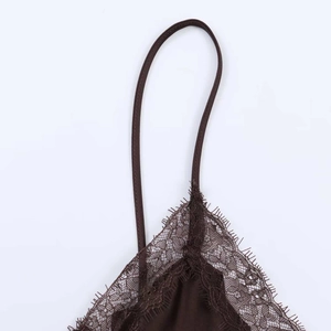 Detail of dark coffee satin top with delicate eyelash lace trim and thin straps