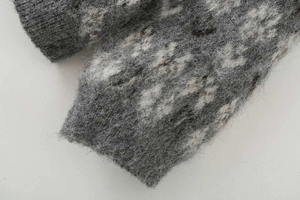 Detailed close-up showing the soft brushed mohair texture and jacquard knit of the sleeve