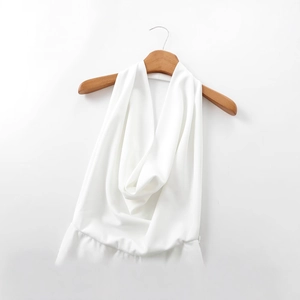 Elegant white cowl neck halter jumpsuit for women with smooth draped fabric and minimalist style