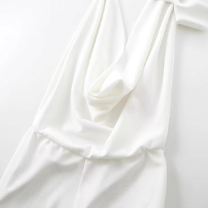 Elegant white halter neck crepe jumpsuit with draped neckline and cinched waist design
