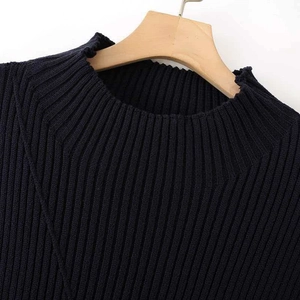 Classic navy ribbed knit tank top for women shown on a wooden hanger against a white wall