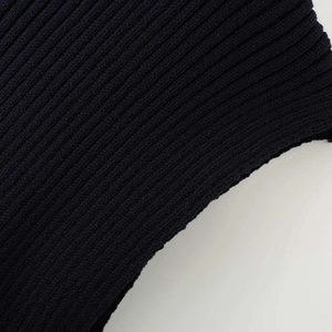 Close-up of navy blue ribbed knit fabric showing elastic texture for women's tank top