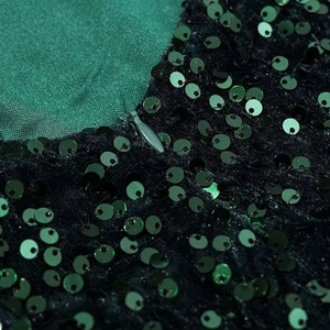 Dark green sequined mini dress featuring a concealed zipper and bow strap details