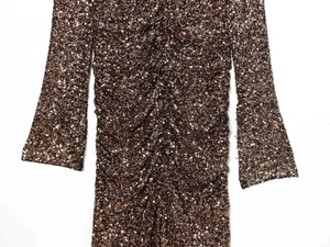 Detail of bronze sequin dress with plunging V-neck and ruched texture on the fabric