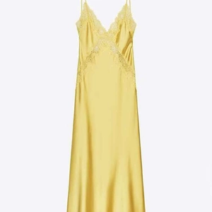 Elegant bright yellow satin midi slip dress with delicate lace V-neckline details