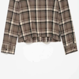 Classic brown plaid long sleeve shirt featuring buttoned cuffs and casual slim fit style