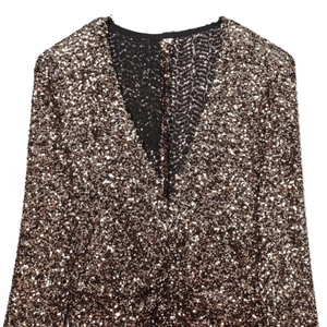 Fashionable gold deep V-neck sequin dress with long sleeves shown in a flat lay view