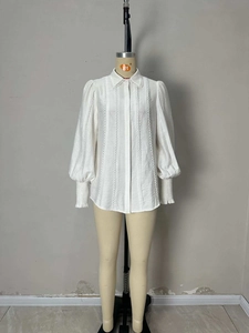 Elegant white lantern sleeve shirt with lace collar and vintage textured fabric