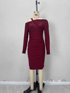 Detail of the elegant wine red off-shoulder knit dress with ruched waist and long sleeves