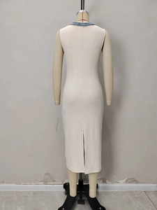 Elegant sleeveless cream knit dress with blue trim v-neck and back slit design