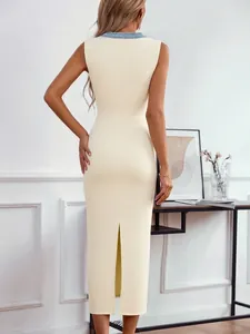 Elegant beige sleeveless knitted midi dress with a back slit and blue V-neck trim detail