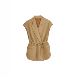 Macro detail of khaki leather vest showing lapel collar and waist tie belt