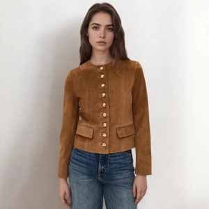 Detail of brown faux suede jacket with metallic gold buttons and flap pocket design
