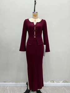 Burgundy knit two-piece set featuring a long-sleeve crop top and matching maxi skirt