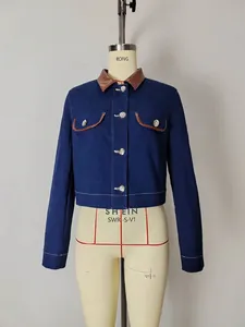 Deep blue denim jacket with brown faux leather collar and silver button details