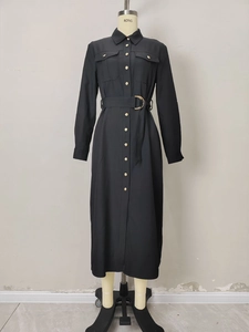 Elegant black long-sleeved shirt dress with gold buttons and waist-defining utility belt