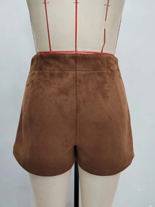 Minimalist brown suede high-waisted shorts with a straight-cut design shown from the back