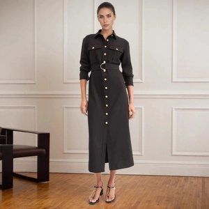 Detail of black shirt dress with gold buttons, utility pockets and metallic buckled belt