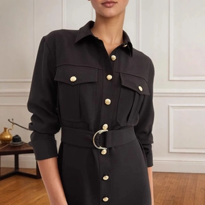 Detail of black shirt dress with gold embossed buttons and D-ring buckle belt