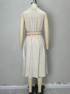 Detail view of the linen V-neck dress back showing classic collar and pleated texture