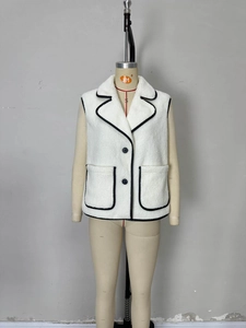 Chic beige faux shearling vest with black contrast piping and lapel collar for women