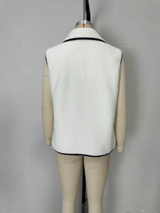 Back view of a white fleece vest featuring black contrast piping on a clothing mannequin