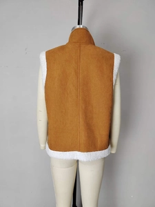 Back view of a brown corduroy vest for women with white sherpa lining and stand collar