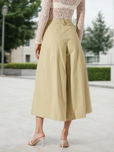 Chic khaki high-waisted wide-leg culottes paired with a white lace long sleeve blouse