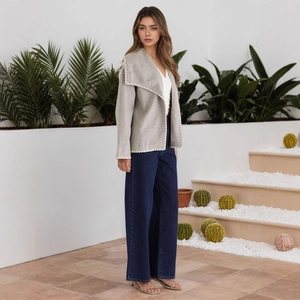 Detail of grey cardigan with white scalloped crochet trim and lapel collar for women