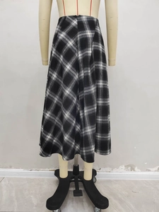 Detailed back view of a high-waisted black and white plaid A-line wool skirt for autumn