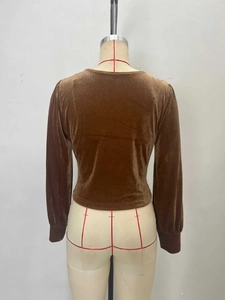 Brown velvet long sleeve top with slim fit and knot design back view on mannequin