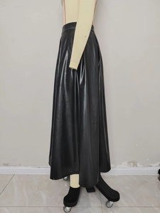 Detailed side view of high waist black PU leather A-line skirt with a flowing hemline