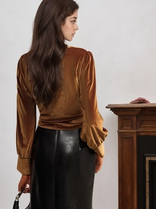 Elegant bronze velvet long sleeve top with twist waist design and puff cuffs