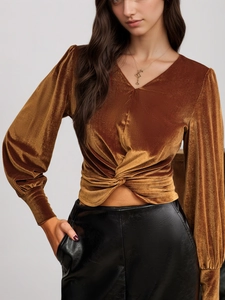 Golden brown velvet long sleeve top with V-neckline and elegant waist knot design